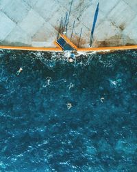 Aerial view of people swimming in sea
