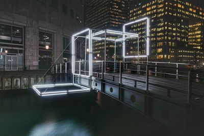 Illuminated modern building in city at night