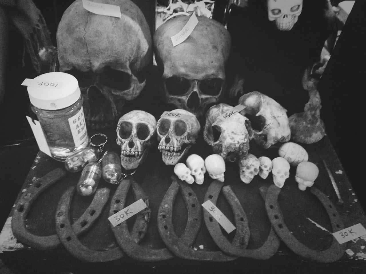 large group of objects, indoors, variation, abundance, high angle view, still life, choice, retail, arrangement, for sale, close-up, stack, in a row, collection, side by side, group of objects, market, text, metal, equipment