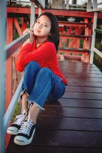 Portrait of girl sitting outdoors