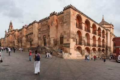 Group of people in front of historical building