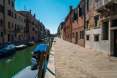 Canal amidst buildings in city