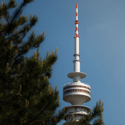 Low angle view of communications tower against sky