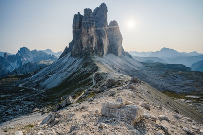 Scenic view of rocky mountains against sky during sunset