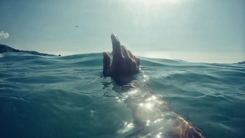 Woman swimming in sea