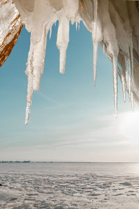 Scenic view of frozen lake against sky