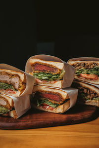 Close-up of food on cutting board against black background