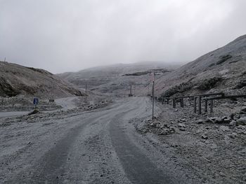 Scenic view of snow covered mountains against sky