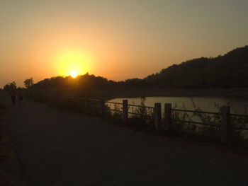 Scenic view of sea against clear sky during sunset