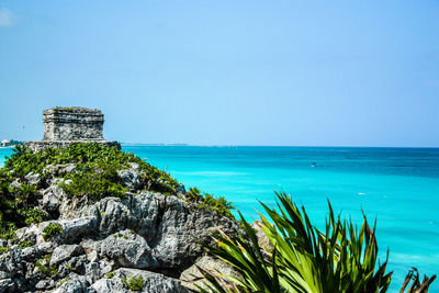 Scenic view of calm sea against clear sky