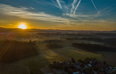 Scenic view of landscape against sky during sunset