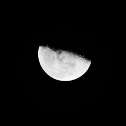 Low angle view of moon against sky at night