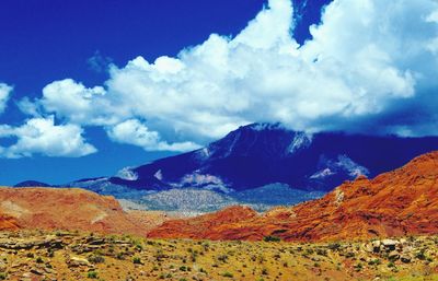 Low angle view of mountain against blue sky