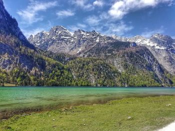 Scenic view of lake and mountains against sky