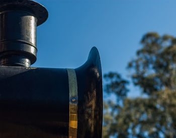 Close-up of metal against sky