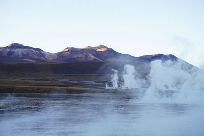 Scenic view of waterfall against clear sky