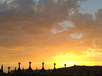 Silhouette of building at sunset