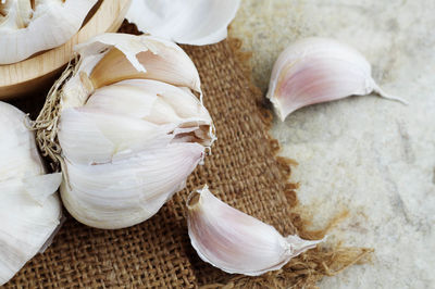 Close-up of garlic on burlap