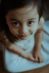 Close-up portrait of cute boy at home