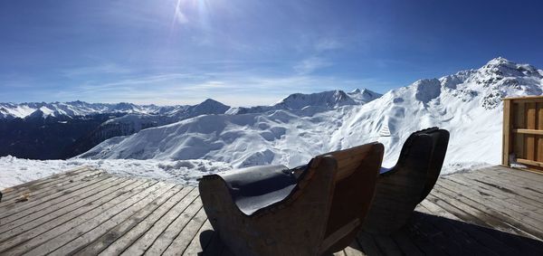 Scenic view of snow covered mountains against sky