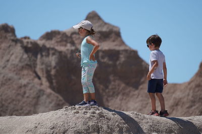 Rear view of people on rock