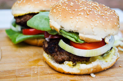 Close-up of burgers on cutting board