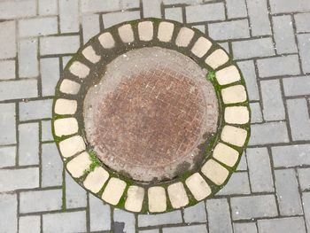 High angle view of stone on cobblestone street