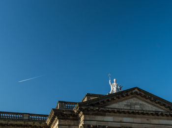 Low angle view of built structure against clear blue sky