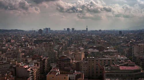 Aerial view of cityscape against sky