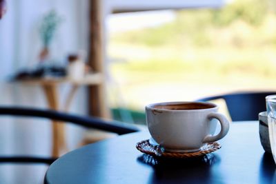 Close-up of coffee cup on table