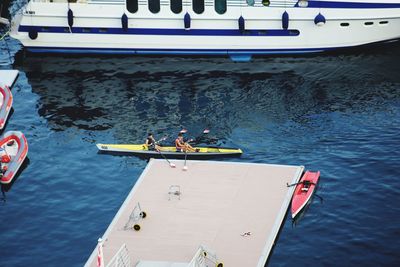 High angle view of people on boat sailing in sea