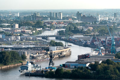 High angle view of river amidst buildings in city