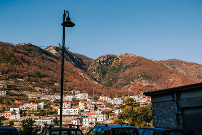 Cars on road against clear sky