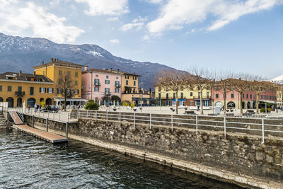 The main square of colico with its colorful houses and the port