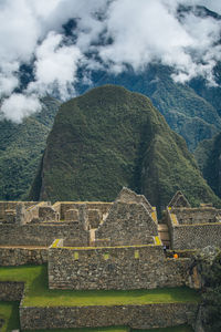 View of old ruins against cloudy sky