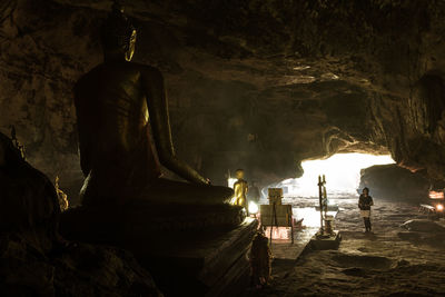 Statue in temple seen from building