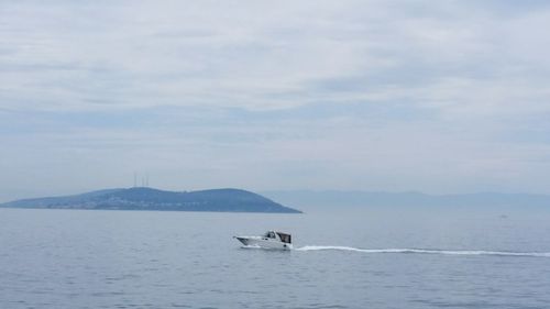 Scenic view of sea against cloudy sky