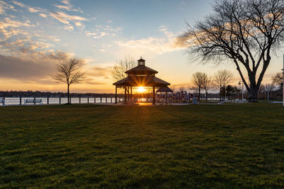 Built structure in park against sky during sunset