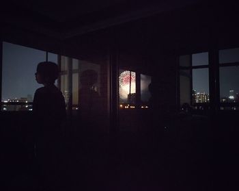 Silhouette of people in dark room
