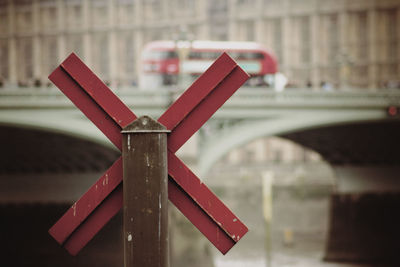 Close-up of railroad crossing sign by westminster bridge