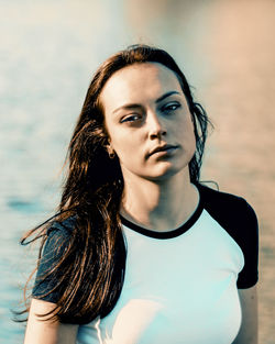 Portrait of beautiful young woman standing outdoors