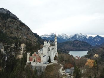 Panoramic view of buildings and mountains against sky