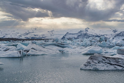 Beautiful jokulsarlon glacier lagoon against dramatic sky during sunset