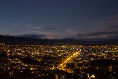 High angle view of illuminated buildings in city at night