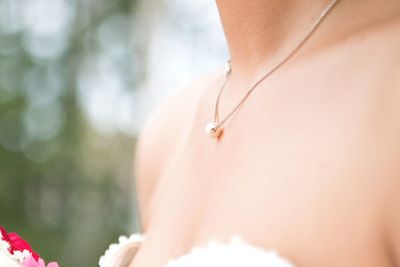 Close-up of necklace on skin