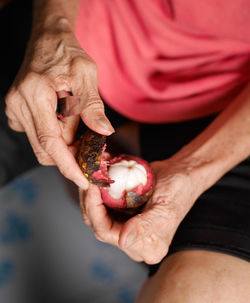 Close-up of man holding ice cream