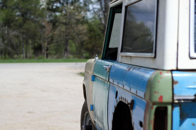 Vintage ford bronco in a car workshop.