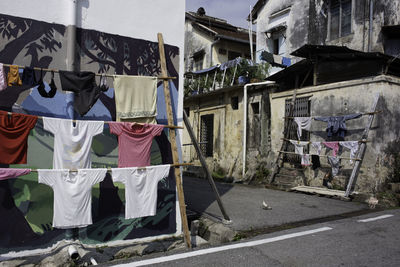 Clothes drying on street by buildings