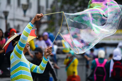 Rear view of people with bubbles