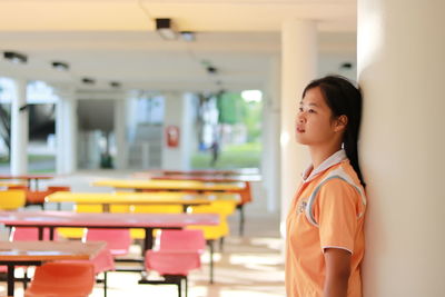Close-up of young woman standing indoors